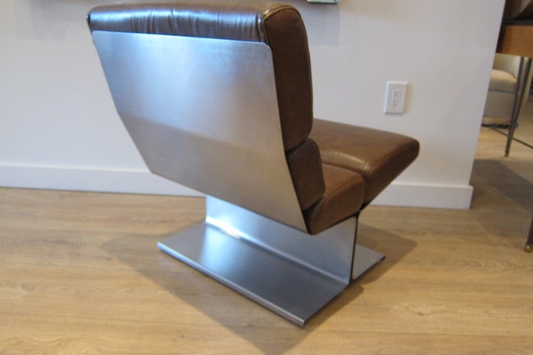 Rare  bented stainless steel slipper lounge chair by Paul Geoffroy for Edition Uginox, France, circa 1970's. Original tobacco brown leather cushions.